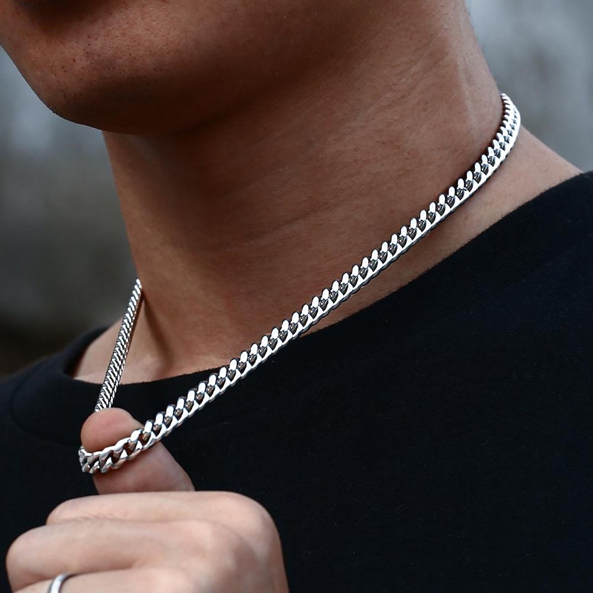 Man wearing a BRIJEWNES silver Cuban chain necklace
